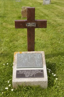 Detail of wooden cross marking grave of three Norwegian sailors