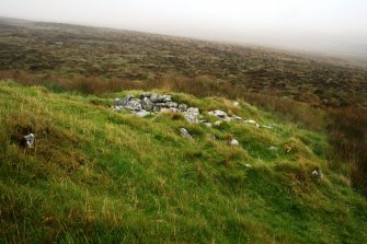 View of shieling at base of cairn.