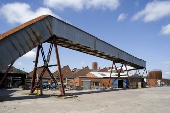 Conveyor, view from SE. This contains a conveyor for carrying rubber from the Banbury Building where it was mixed and to the moulding and other process buildings in the former Arrol Johnston Factory. This dates from the 1940s and has no relation to the original car factory.