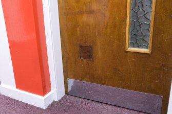 Interior. Main stand, ground floor, match official's room, detail of repair to door