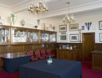 Interior. View of the boardroom, including the trophy cabinet and club memorabilia, within the main stand of Pittodrie Stadium
