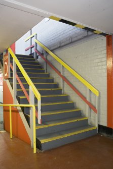 Interior. Main stand, lower concourse, view of stair to stand seating.