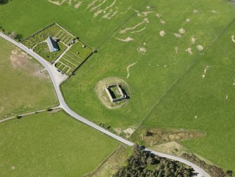 Oblique aerial view of Abernethy Parish Church and Castle Roy, taken from the ENE.