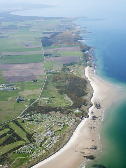 General oblique aerial view of Moray Golf Course and Covesea Village, taken from the ENE.
