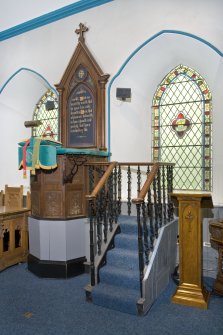 Interior. Pulpit and stained glass windows. View from NW