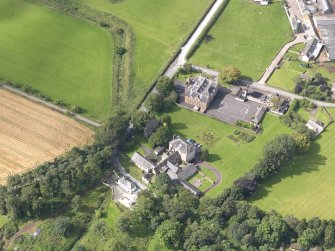 Oblique aerial view of Wallacehall Academy and Closeburn School, taken from the NE.