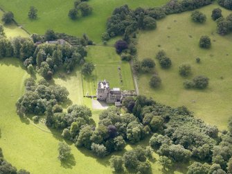 Oblique aerial view of Capenoch House and stables, taken from the NNW.