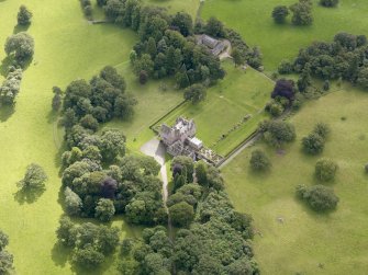 Oblique aerial view of Capenoch House and stables, taken from the NW.