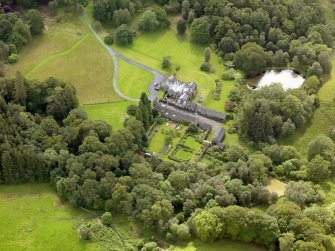 Oblique aerial view of Knocknalling House and policies, taken from the NW.