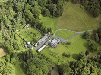 Oblique aerial view of Knocknalling House and policies, taken from the SW.