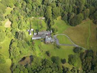 Oblique aerial view of Knocknalling House and policies, taken from the SSE.