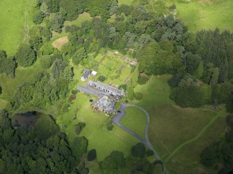 Oblique aerial view of Knocknalling House and policies, taken from the NNW.