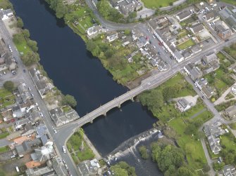 Oblique aerial view of Newton Stewart, centred on the Bridge of Cree, taken from the SSW.