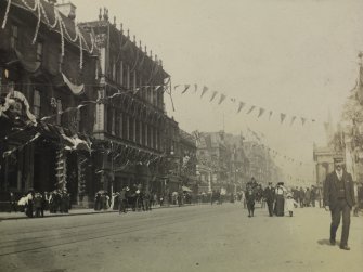 Princes Street looking east from outside No 85 showing bunting for the coronation of Edward VII.  View also shows pedestrians and  horse-drawn carriages.
PHOTOGRAPH ALBUM NO 76: THE CORONATION ALBUM VOL.2