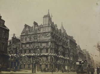 View of Palace Hotel and Princes Street from south west showing decorations for the coronation of Edward VII.  View also shows pedestrians and a tram.
PHOTOGRAPH ALBUM NO 76: THE CORONATION ALBUM VOL.2
