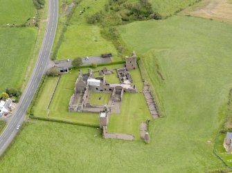Oblique aerial view of Crossraguel Abbey, taken from the WSW.