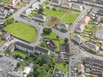 Oblique aerial view of Maybole, centred on St Mary's Church, taken from the NW.