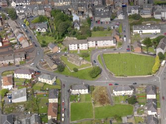 Oblique aerial view of Maybole, centred on St Mary's Church, taken from the SE.