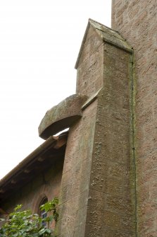 Detail of buttress head and stone spout on north of bell tower