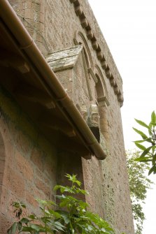 Detail of buttress head and stone spout to north of bell tower, taken from the north east