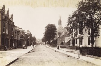 General view of Henderson Street, Bridge of Allan, from SE, including Royal Hotel and United Presbyterian Church.
Titled: 'Royal Hotel and Stirling Road, Bridge of Allan. 2051. J V.'
PHOTOGRAPH ALBUM NO:11 KIRSTY'S BANFF ALBUM
