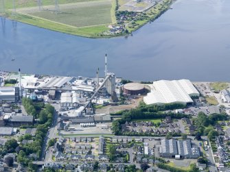 General oblique aerial view of Alloa Gasworks with glasshouse adjacent, taken from the NNE.