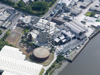 Oblique aerial view of Alloa Glassworks, taken from the WSW.