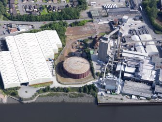 Oblique aerial view of Alloa Glassworks, taken from the SSW.