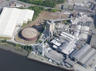 Oblique aerial view of Alloa Glassworks, taken from the SSE.