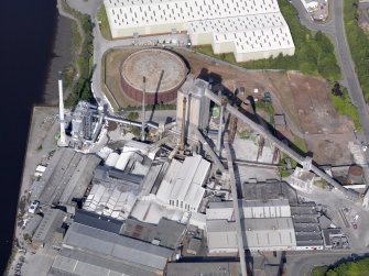 Oblique aerial view of Alloa Glassworks, taken from the ESE.