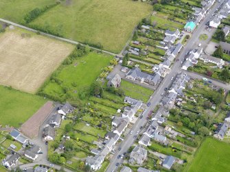 Oblique aerial view of the village centred on Gartmore Parish Church, taken from the S.