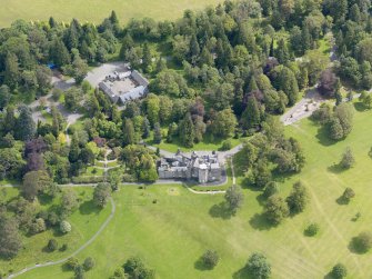 Oblique aerial view of Balloch Castle and stables, taken from the WSW.