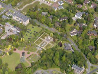 Oblique aerial view of Helensburgh, centred on Hermitage Park War Memorial, taken from the SSE.