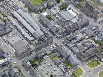 Oblique aerial view of Helensburgh Central Station and Council Offices, taken from the NW.