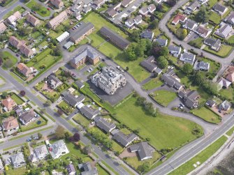 Oblique aerial view of Helensburgh, centred on Cairndhu House, taken from the SW.