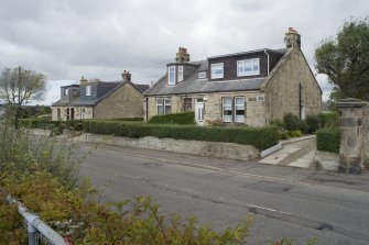 Street view showing four semi-detached cottages to the Western end of Borrowstoun Road, Bo'ness, taken from the South-East. This photograph was taken as part of the Bo'ness Urban Survey to illustrate the character of the Borrowstoun Area of Townscape Character.