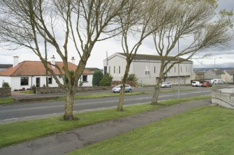 Street view showing traditional cottages at 132-134 Linlithgow Road and modernist telephone exchange next door. This image shows where the 20th-century expansion of Bo'ness meets the settlement of Borrowstoun, which existed around the crossroads of Borrowstoun Road and Linlithgow Road. This photograph was taken as part of the Bo'ness Urban Survey to illustrate the character of the Borrowstoun Area of Townscape Character.