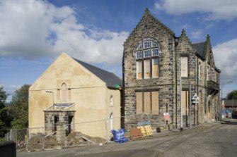 General view of the former St Mary's Roman Catholic Church, Providence Brae, Bo'ness (left) and Meeting Hall at 37 Stewart Avenue, Bo'ness (right), taken from the West. This image was taken when both buildings were undergoing conservation and restoration work. This photograph was taken as part of the Bo'ness Urban Survey to illustrate the character of the School Brae Area of Townscape Character.