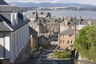 View looking North down School Brae, Bo'ness, taken from Stewart Avenue, Bo'ness. South Street can be seen at the bottom of the hill and the Firth of Forth in the background. This photograph was taken as part of the Bo'ness Urban Survey to illustrate the character of the School Brae Area of Townscape Character.