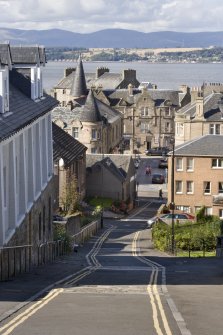 View looking North down School Brae, Bo'ness, taken from Stewart Avenue, Bo'ness. South Street can be seen at the bottom of the hill and the Firth of Forth in the background. This photograph was taken as part of the Bo'ness Urban Survey to illustrate the character of the School Brae Area of Townscape Character.