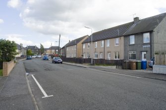 Street view showing terraced housing situated at 1-14 Baker Street, Bo'ness, taken from the North-West. This photograph was taken as part of the Bo'ness Urban Survey to illustrate the character of the Newtoun Area of Townscape Character.