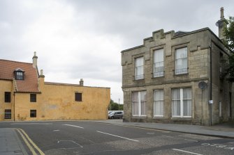 View of the Southern elevation of 57 North Street, Bo'ness, taken from the South. Dymock's Building is also visible to the left of the shot. This photograph was taken as part of the Bo'ness Urban Survey to illustrate the character of the Town Centre Area of Townscape Character.