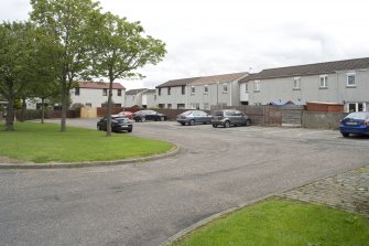 General street view of Pennelton Place, Bo'ness, showing communal central parking area and the 'rear' of terraced housing. Acess to the housing is via pedestrian pathways to the 'front' and via the communal parking to the 'rear'. This photograph was taken as part of the Bo'ness Urban Survey to illustrate the character of the Hillcrest and Brewlands Area of Townscape Character.