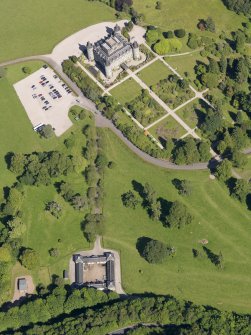 Oblique aerial view of Inveraray Castle and stables, taken from the W.