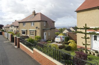Street view showing the Northern side of Kinneil Drive (Nos 5-9 in the foreground), Bo'ness, taken from the South-East. This photograph was taken as part of the Bo'ness Urban Survey to illustrate the character of the Forthview and Grahams Crescent Area of Townscape Character.