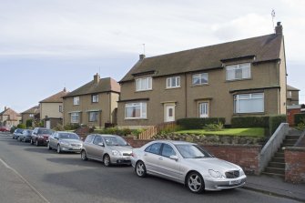 Street view showing the Southern side of Kinneil Drive (Nos 4-10 in the foreground), Bo'ness, taken from the North-West. This photograph was taken as part of the Bo'ness Urban Survey to illustrate the character of the Forthview and Grahams Crescent Area of Townscape Character.