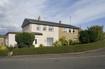 View of the semi-detached housing situated at 11 Bo'Mains Road and 1 Jamieson Avenue, Bo'ness, taken from the South-West junction of Bo'Mains Road with Jamieson Avenue and Kinneil Drive. This photograph was taken as part of the Bo'ness Urban Survey to illustrate the character of the Forthview and Grahams Crescent Area of Townscape Character.
