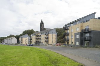 Street view showing three modern apartment blocks at 207-213 Corbiehall, Bo'ness, taken from the North-West. This photograph was taken as part of the Bo'ness Urban Survey to illustrate the character of the Corbiehall and Snab Area of Townscape Character.
