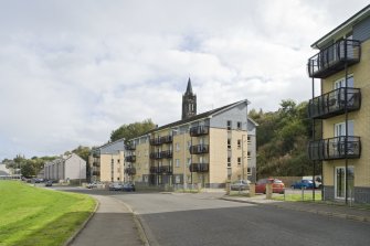 Street view showing three modern apartment blocks at 207-213 Corbiehall, Bo'ness, taken from the North-West. This photograph was taken as part of the Bo'ness Urban Survey to illustrate the character of the Corbiehall and Snab Area of Townscape Character.