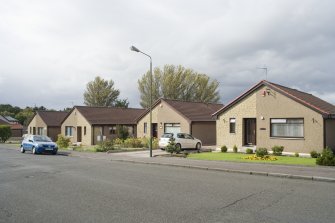 Street view of detached bungalows at 82-88 Deanfield Road, Bo'ness, taken from the East. This photograph was taken as part of the Bo'ness Urban Survey to illustrate the character of Deanfield Area of Townscape Character.